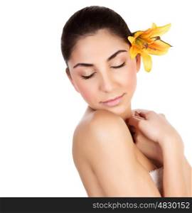 Image of sensual brunette girl with fresh yellow lily flower in head isolated on white background, closeup portrait of gorgeous woman with closed eyes relaxed in luxury spa salon, herbal cosmetics