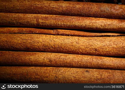 Image of several cinnamon sticks in horizontal position