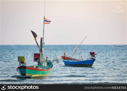 Image of small boat fishing on the sea.