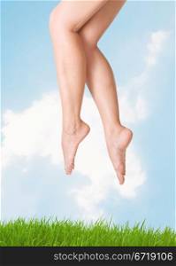 image of smooth,sexy and beautiful female legs against the sky