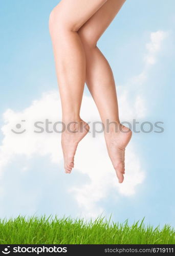 image of smooth,sexy and beautiful female legs against the sky