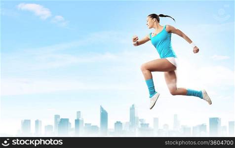 Image of sport girl in jump against city background