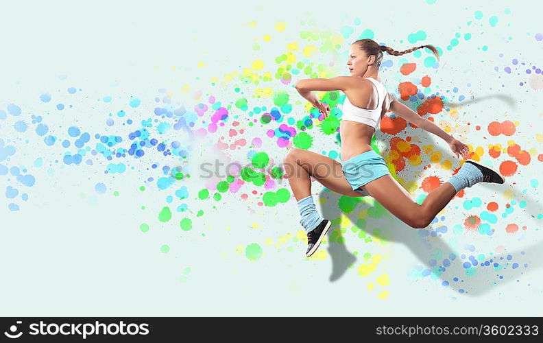 Image of sport girl in jump against color spot background