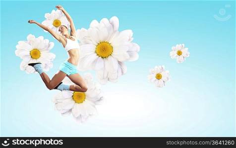 Image of sport girl in jump against flower background
