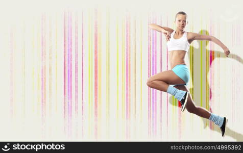 Image of sport woman jumping. Image of sport girl in jump against color background