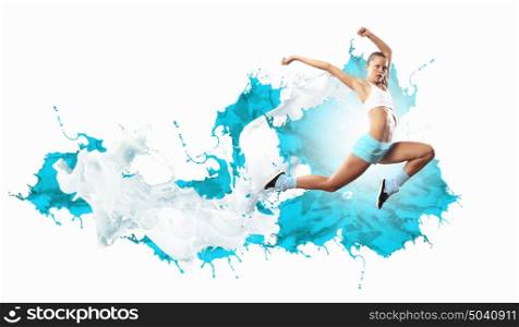 Image of sport woman jumping. Image of sport girl in jump against color splashes background