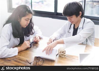 Image of successful medical doctors discussing, Doctors and researchers are examining the documents.