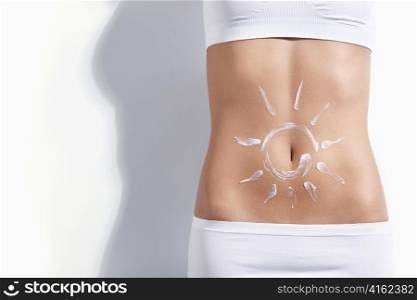 Image of the sun on the belly of a young girl