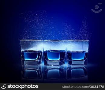 Image of three glasses of blue liquid