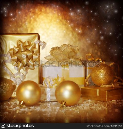 Image of traditional New Year gifts, Christmas present box wrapping in shiny golden festive paper, Christmastime still life isolated on dark glowing background, Xmas eve, holiday surprise