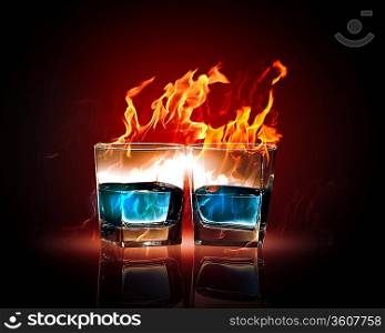 Image of two glasses of burning emerald absinthe