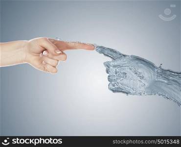 Image of two human hands touching each other