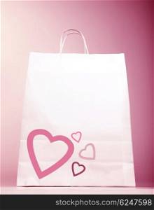 Image of white shopping bag with heart isolated on pink background, Valentines day, birthday present bag, new romantic purchase, spending money, market sack, hearts decoration, love concept&#xA;