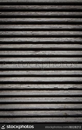Image of white wooden shutters, covering a window or door