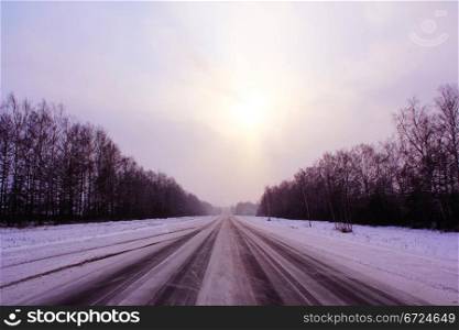 Image of winter road and cloudy sky