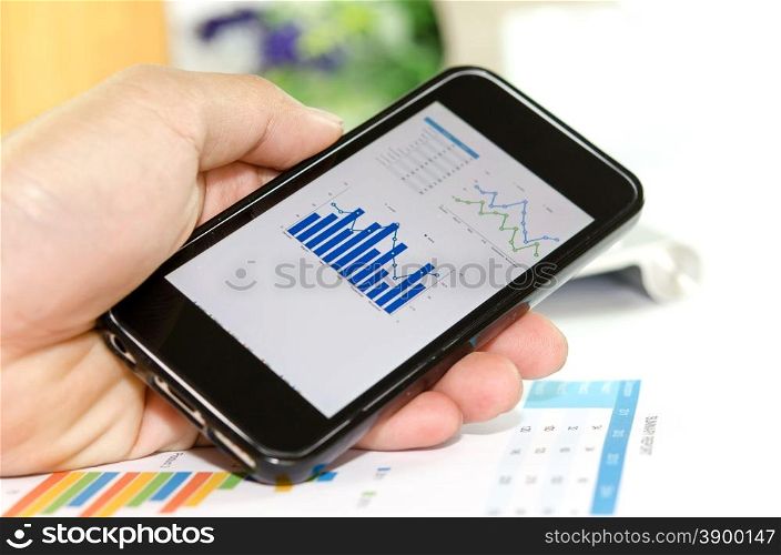 Image of working place with mobile phone
