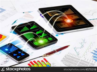 Image of working place with mobile phone, ipad and tablet PC