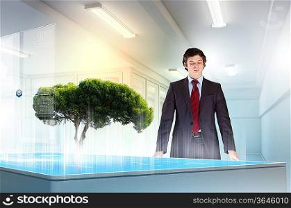 Image of young businessman against high-tech picture of environment concept