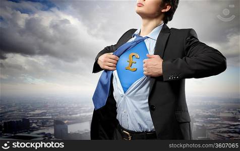 Image of young businessman in superhero suit with pound sign on chest