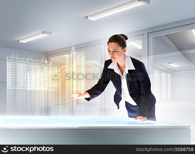 Image of young businesswoman clicking icon on high-tech picture