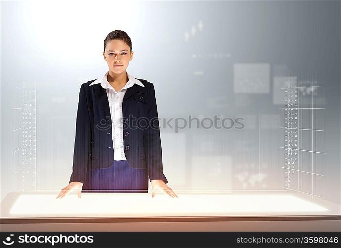 Image of young businesswoman standing against high-tech picture background