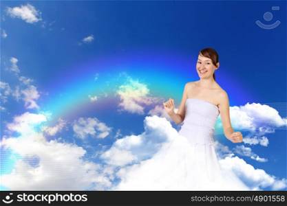 Image of young woman against blue sky background