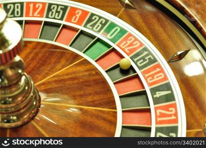 image with a casino roulette wheel with the ball on number 15