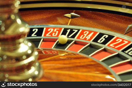 image with a casino roulette wheel with the ball on number 17