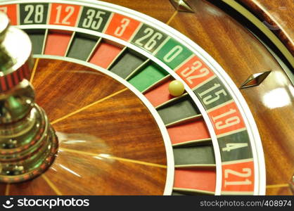 image with a casino roulette wheel with the ball on number 32