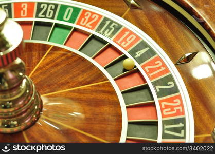 image with a casino roulette wheel with the ball on number 4