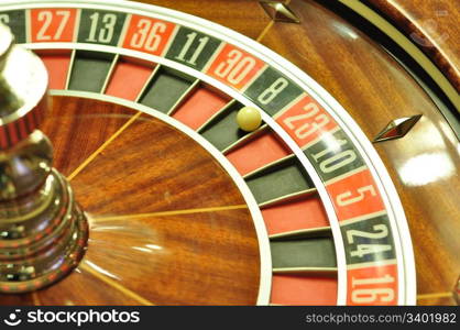 image with a casino roulette wheel with the ball on number 8