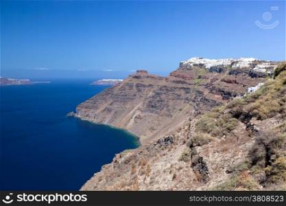 Imerovigli town on the highest cliff of the caldera, Santorini island, Greece. View on Aegean sea