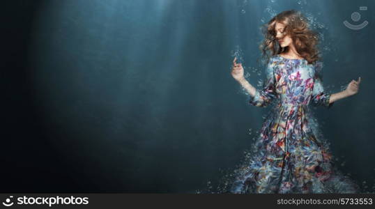 Immersion. Woman in Deep Blue Sea. Fantasy