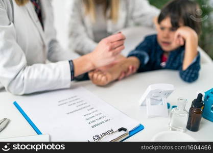 Immunologist Testing Allergy Reaction on a Boy’s Arm. Immunologist Testing Allergy Reaction of a Patient