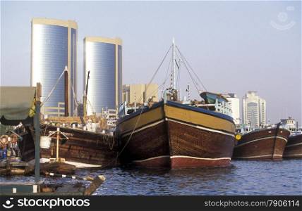 Import and export goods at the harbour at the Dubai creek in the old town in the city of Dubai in the Arab Emirates in the Gulf of Arabia.. ARABIA EMIRATES DUBAI