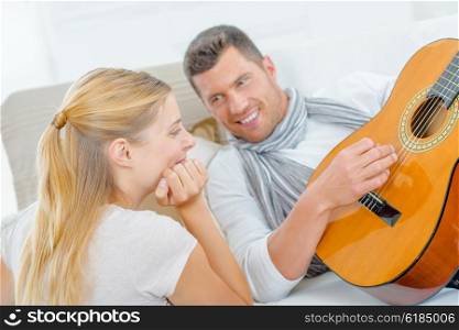Impressing a girl by playing the guitar