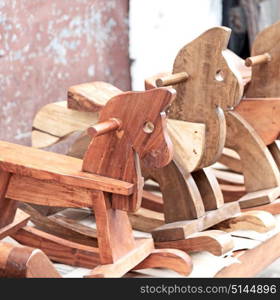 in a old market rocking horse made in wood like abstract concept