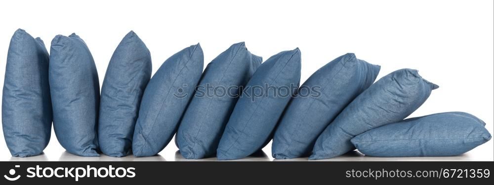 in a row blue denim pillows isolated on white