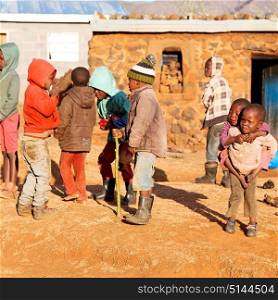in africa group of alone children near their poor home