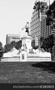 in austalia the antique statue in the park near the skyscrapers