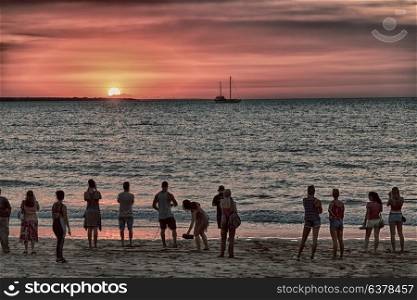 in austalia the bay of darwin in the sunrise and silhouette people