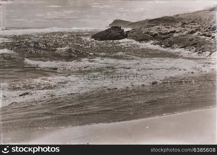 in australia fraser island the beach near the rocks in the wave of ocean