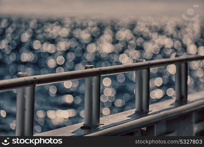 in australia the bokeh of light from the railings boat and ocean