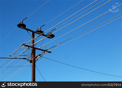 in australia the concept of power line with electrical pole in the clear sky