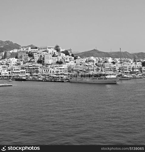 in cyclades island harbor and boat santorini naksos europe house construction old history