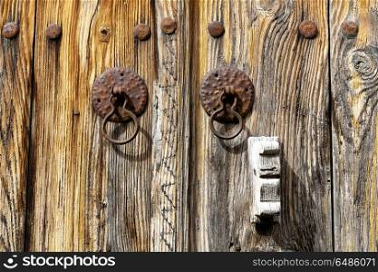 in cyprus the old door and the antique rusty knocker concept of safety. the old door and the antique rusty knocker