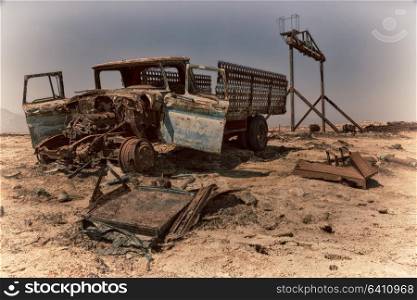 in danakil ethiopia africa in the old abandoned italian village colony rusty antique car and hot concept of horror apocalypse