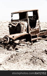 in danakil ethiopia africa in the old abandoned italian village colony rusty antique car and hot concept of horror apocalypse