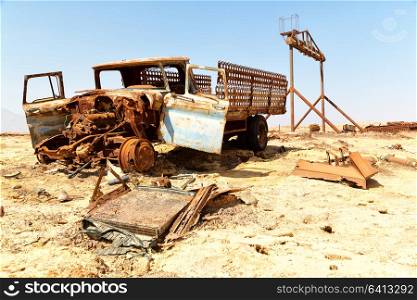 in danakil ethiopia africa in the old abandoned italian village colony rusty antique car and hot concept of horror apocalypse