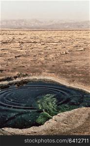 in danakil ethiopia africa the black lake with boiling oil and hot
